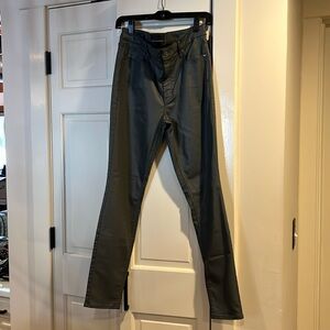 A gently worn high rise coated skinny jeans in a size 12 from WHBM